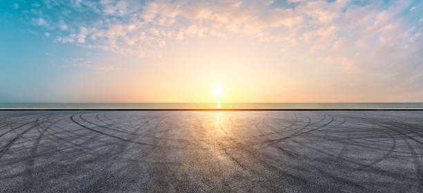 istock Circuit road and dramatic sky with coastline panorama at sunset 1061976902