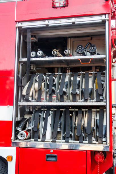 istock Rescue fire truck equipment. Compartment of the rolled up fire hoses on a fire engine 1061977270