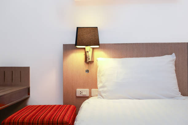istock beautiful modern bedroom in hotel with white wall 1061980502