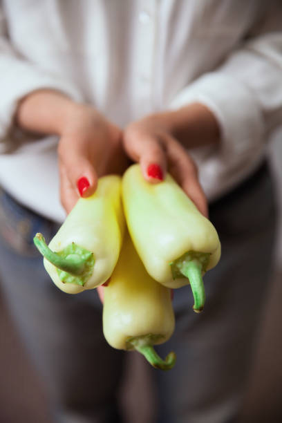 istock Bell pepper on young woman hands 1061990178