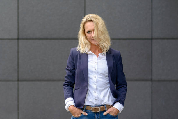 istock Attractive serious trendy blond woman 1061996844