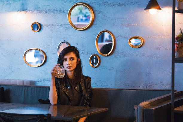 Woman drinking whiskey