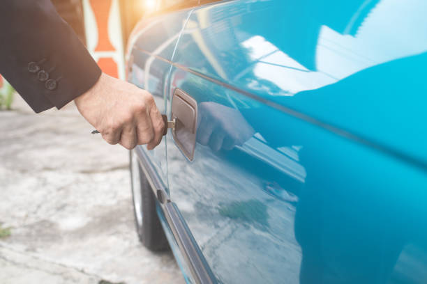 istock businessman hand unlock or lock old car door with key 1062001130