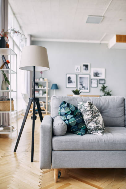 istock gray sofa and floor lamp in the interior. 1062007562