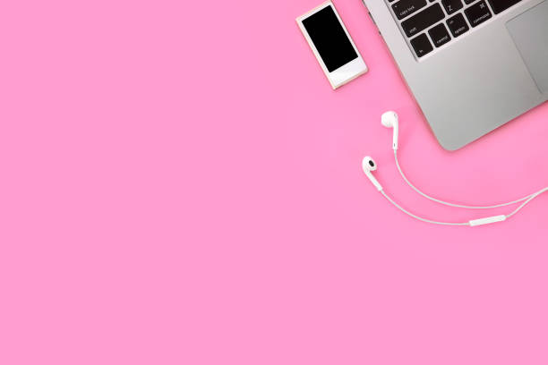 istock break time on technology working business table with smartphone, musical player, ear phone and computer on pink pastel background 1062008430