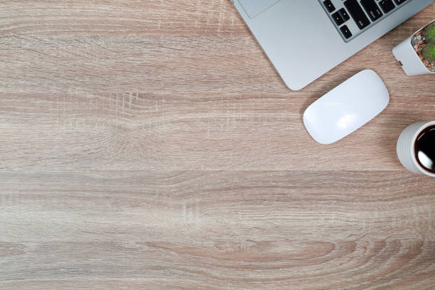 istock technology working wood table with laptop computer, coffee cup and plant 1062008452