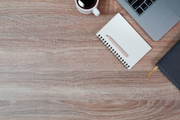 istock technology working wood table with laptop computer, coffee cup and plant 1062008566