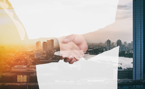 istock Double exposure of handshake over city view and river with sun light 1062021830