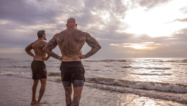 istock Tattooed Senior Man coaching young man During Workout 1062028906