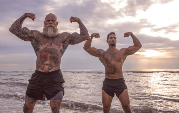 istock Tattooed Senior Man coaching young man During Workout 1062029082