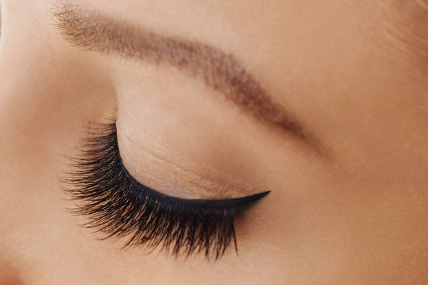 istock Female eye with extreme long false eyelashes 1062029436