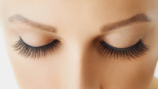 istock Female eyes with extreme long false eyelashes 1062031604