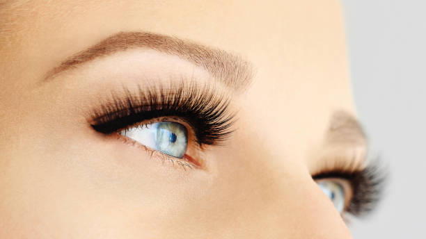 istock Female eyes with extreme long false eyelashes 1062032772
