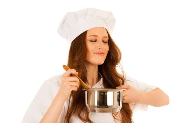 istock Beautiful Happy young chef cooks isolated over white 1062032802