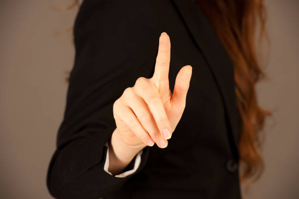 istock Attractive business woman pressing a virtual button 1062032930