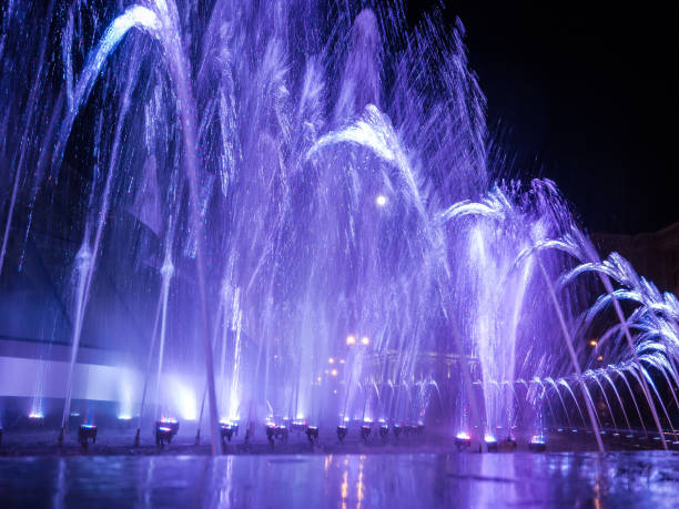 istock Colored water jets in the fountain at night with full moon. 1062033100