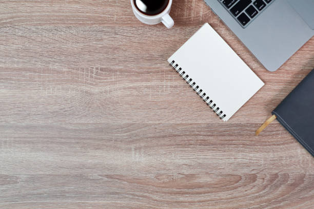 istock technology working wood table with laptop computer, coffee cup and plant 1062033330