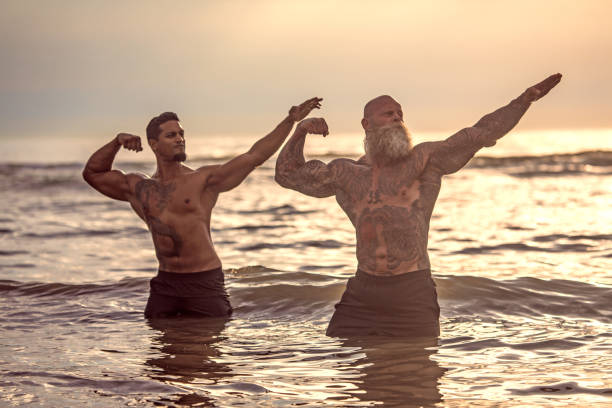 istock Tattooed Senior Man coaching young man During Workout 1062037200