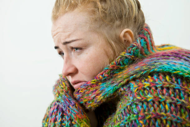 istock Young woman suffering from cold and flu at home, closeup 1062037564