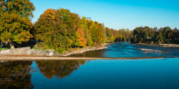 istock trees in autumn color along river Lech.   Landsberg am Lech, Germany 1062037700