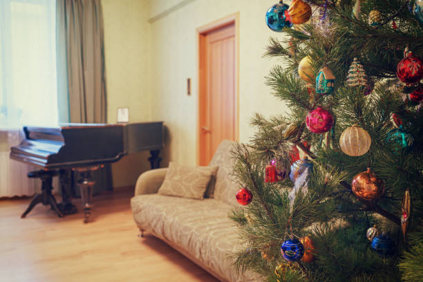 istock Beautiful festive decorated Christmas tree in living room interi 1062039538