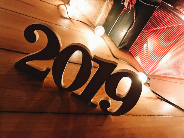 istock christmas present on parquet floor for the new year 2019 1062039638
