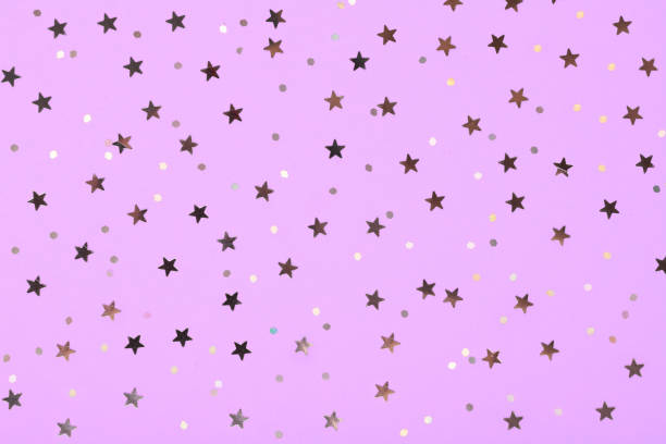 istock Christmas pattern made of silver stars on pink background. Winter concept. Flat lay. 1062039702