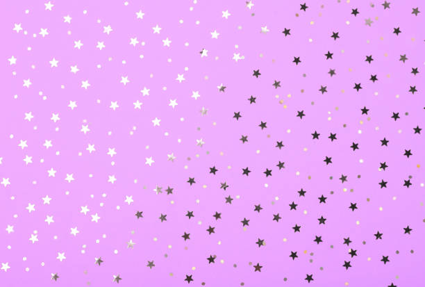 istock Christmas pattern made of silver stars on pink background. Winter concept. Flat lay. 1062039766