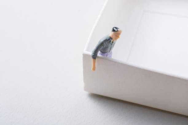 istock Tiny figurine of man model  in view 1062040668
