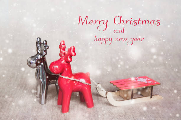 istock Two christmas deers with sledges. Merry Christmas - poster or postcard design. 1062046014