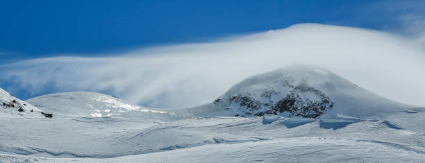 istock White winter mountains covered with snow in blue cloudy sky. Alps. Austria. Pitztaler Gletscher 1062048232