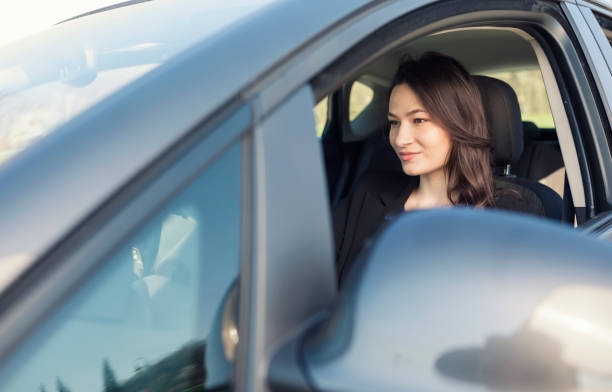 istock Woman driving a car 1062057632