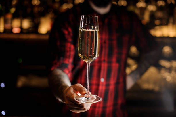 istock Professional bartender serving champagne in a glass 1062067014