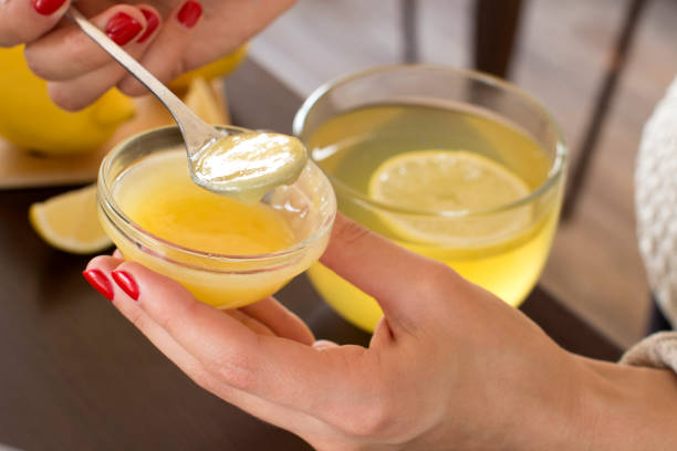 istock young woman making lemon tea 1062067434