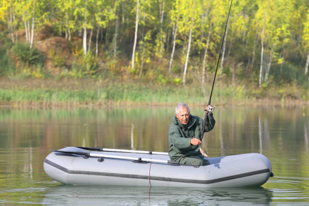 istock An elderly fisherman just caught a fish 1062077838