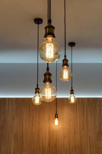 istock close-up view of illuminated light bulbs hanging in empty room 1062088056