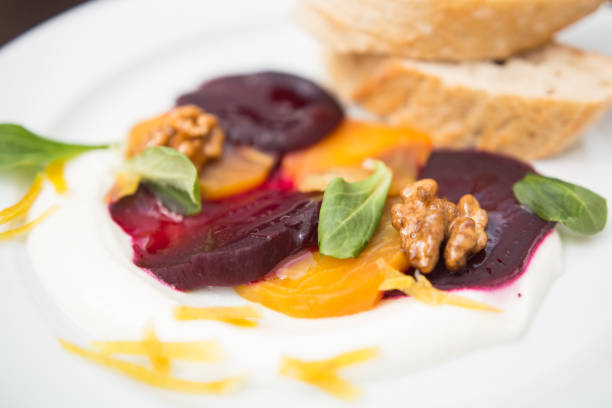 istock Two color vegetarian root carpaccio with goat cheese and lemon peel 1062090900