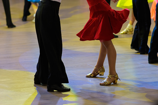 couple feet of dancers, woman and man latino dancing