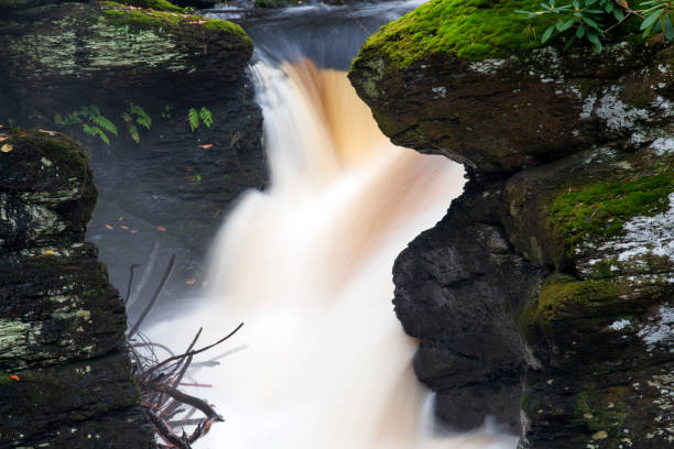istock Waterfalls through narrow gorge 1062103634