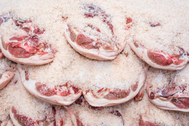 istock Salting process of iberian ham. Meat industry concept. 1062110972