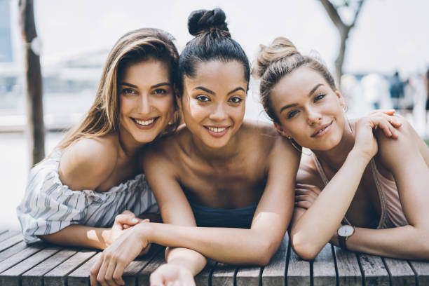 istock Three girls resting outdoors 1062116688