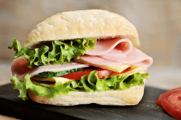 istock ham and cheese sandwiches on wooden Board 1062122636