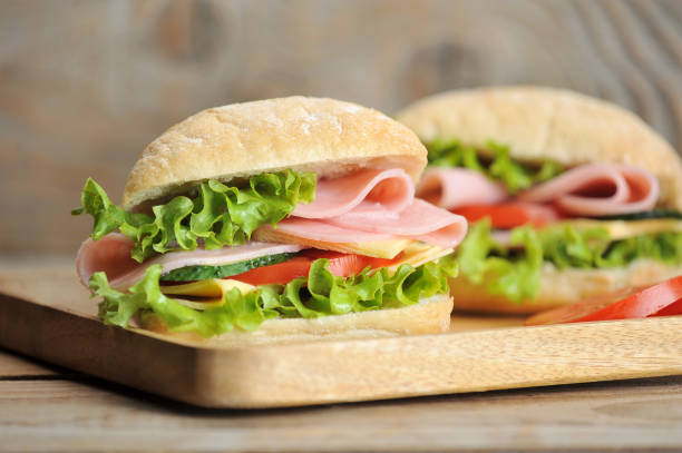 istock ham and cheese sandwiches on wooden Board 1062123216