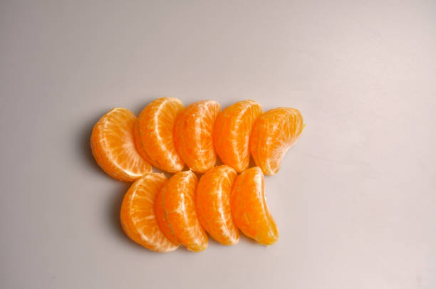 orange natural mandarin slices on a white background without processing