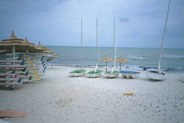 istock Beach with small sailboats 1062126200