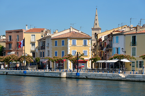 Channel and bell tower at Martigues in France, a commune northwest of Marseille. It is part of the Bouches-du-Rhône department in the Provence-Alpes-Côte d'Azur region on the eastern end of the Canal de Caronte