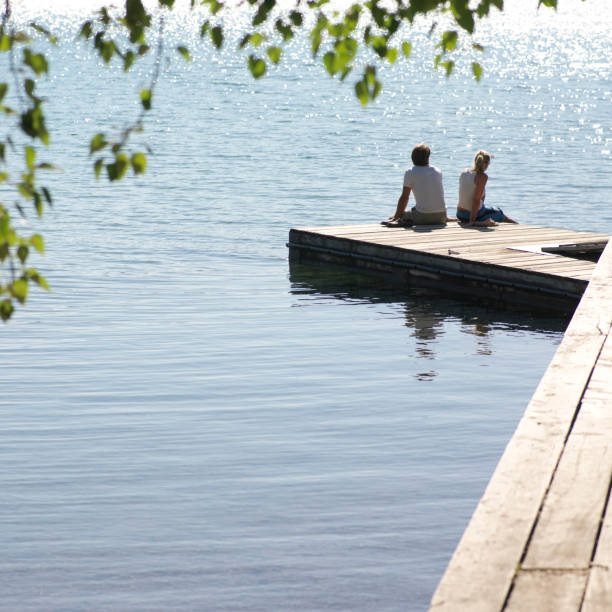 Dilapidated wooden footbridge overlooking a beautiful natural lake