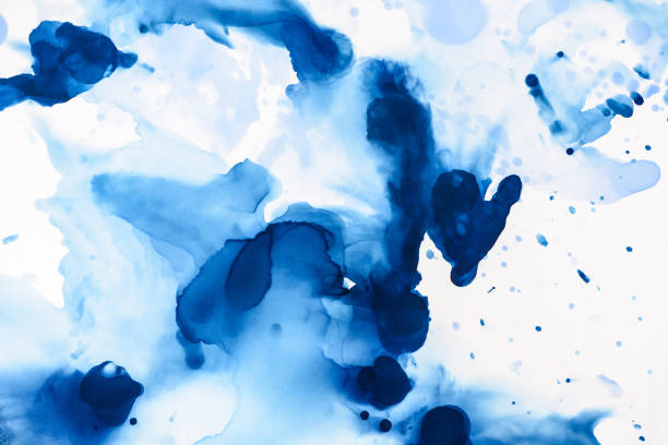istock abstract blue splashes of alcohol ink on white 1062131298