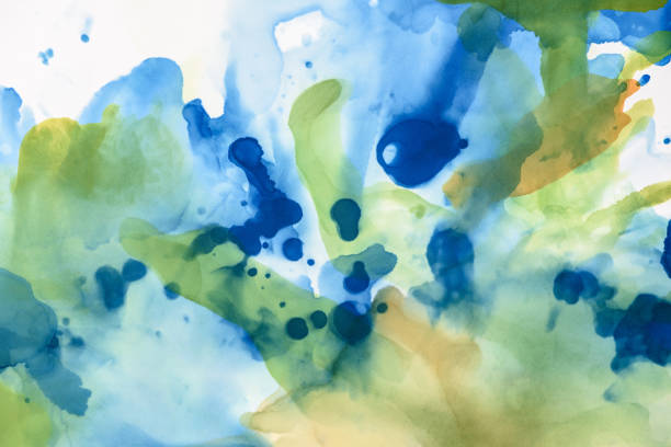 istock beautiful green and blue splashes of alcohol inks as abstract background 1062131620