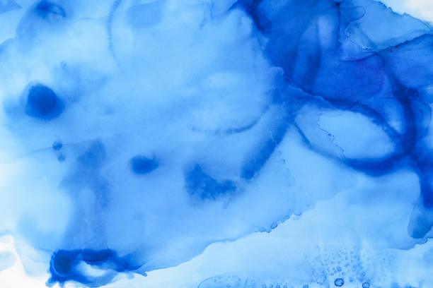 istock artistic blue splashes of alcohol ink as abstract background 1062131752